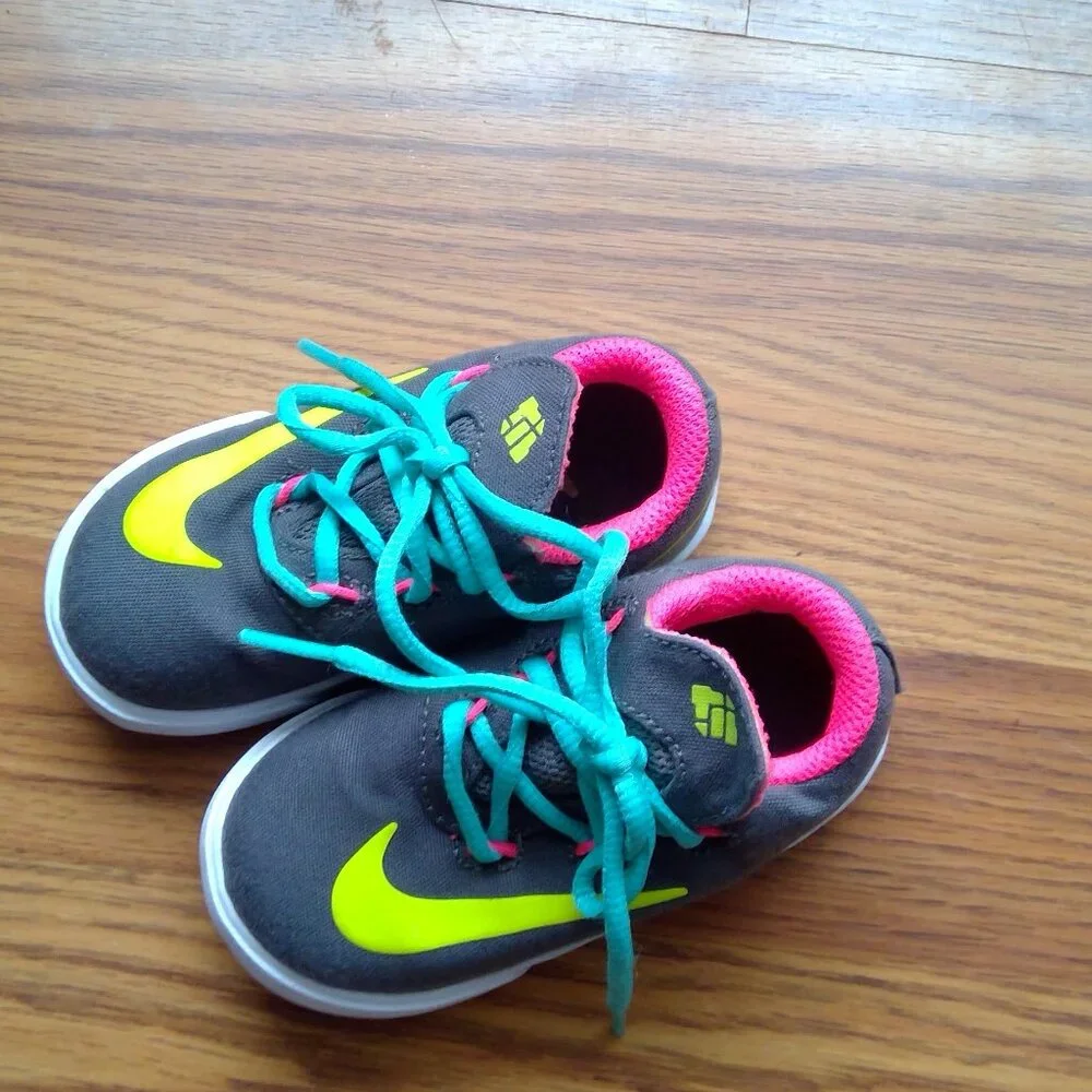 Nike Kids Dark Gray Sneakers with Neon Yellow Swoosh and Teal Laces